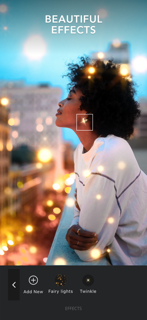 A woman with aesthetic fairy light and twinkle effects added to her photo in the VIMAGE app