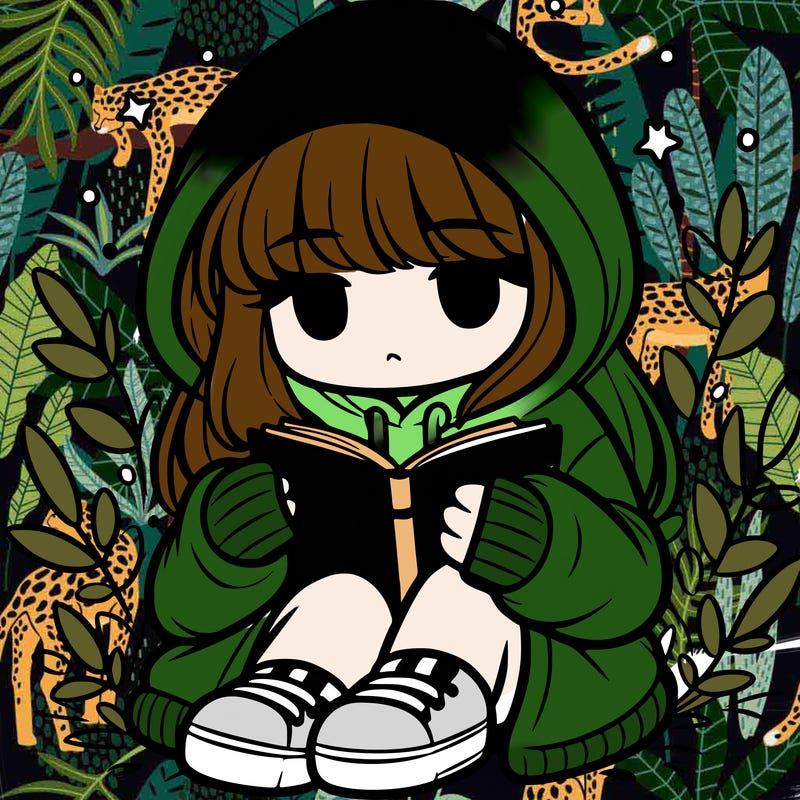 girl in oversized hoodie reading a book