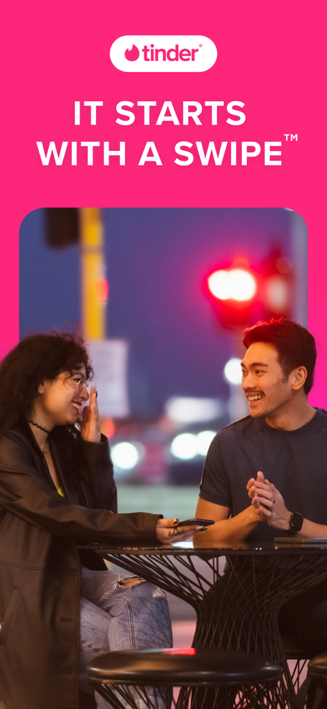 Tinder dating app promotional screen featuring a couple on a date with the slogan It Starts With A Swipe