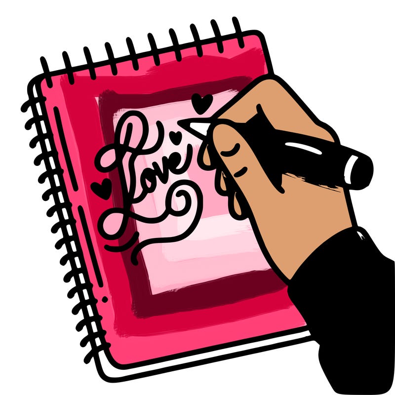 a hand writing “love” in calligraphy on a notebook