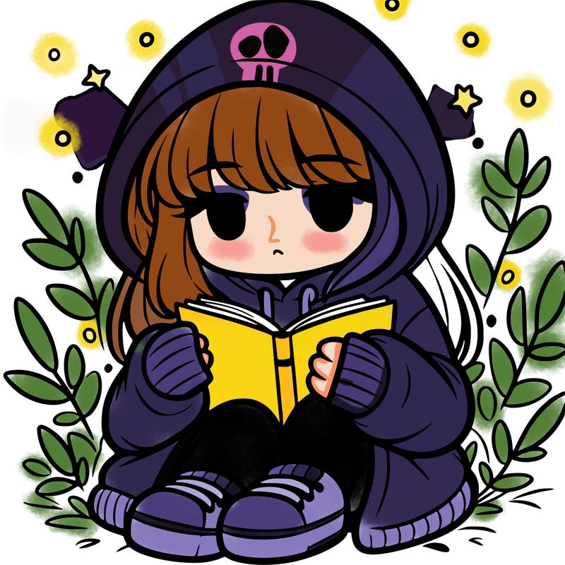 girl in oversized hoodie reading a book
