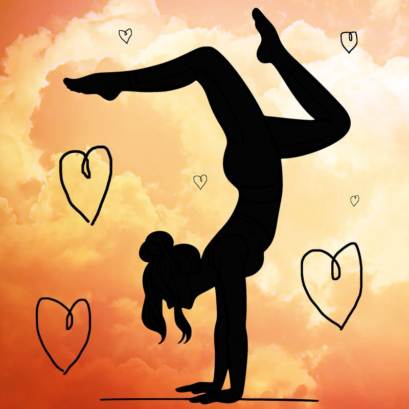 a woman doing a handstand