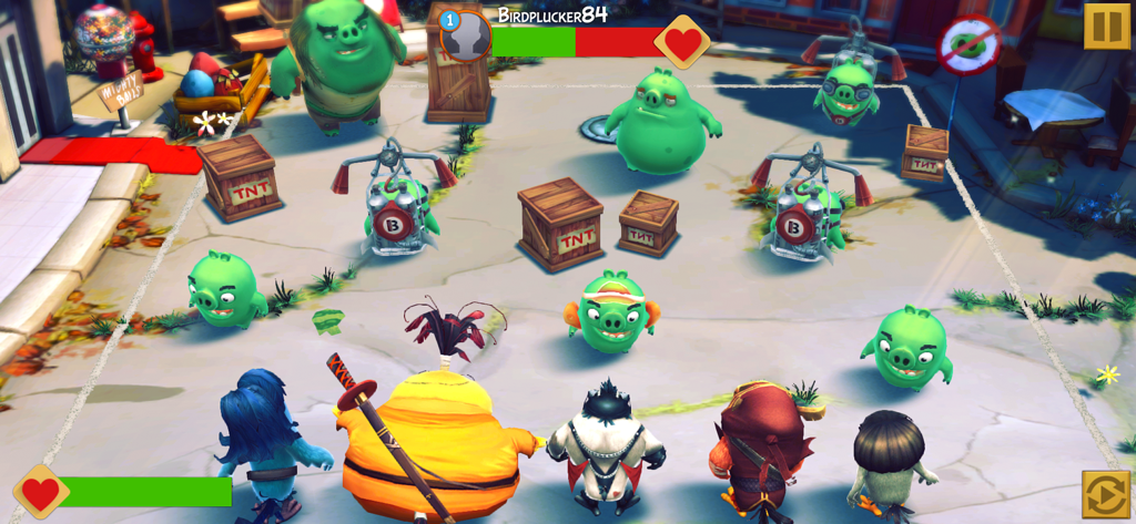 Angry Birds Evolution - A tactical combat scene from Angry Birds Evolution featuring a team of birds facing off against green pigs.