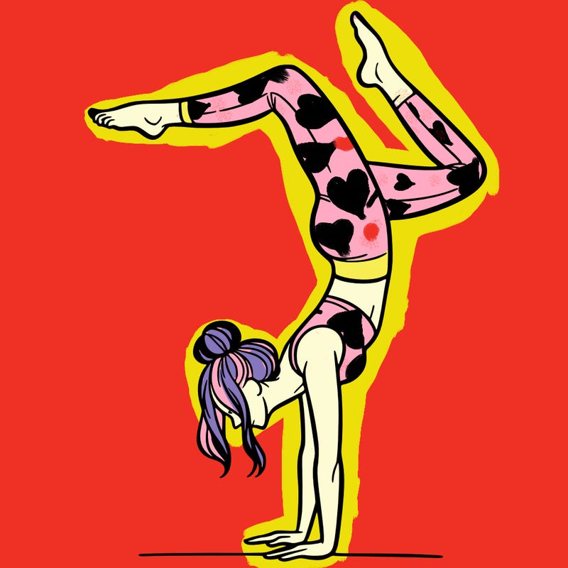 a woman doing a handstand