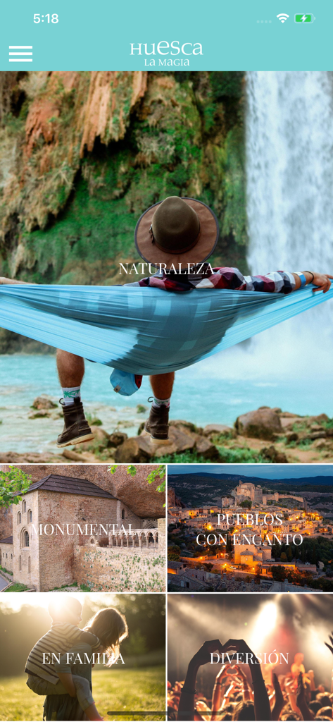 Huesca La Magia - La schermata principale dell'app Huesca La Magia che mostra varie categorie di viaggio come natura, monumenti e villaggi affascinanti.