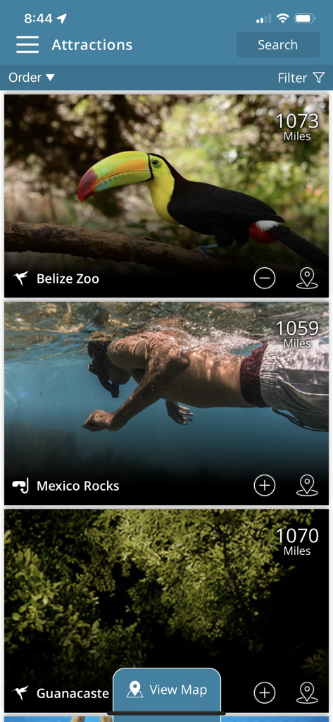 Travel Belize - 사진과 거리가 표시된 벨리즈 관광 명소 목록을 표시하는 모바일 앱 인터페이스