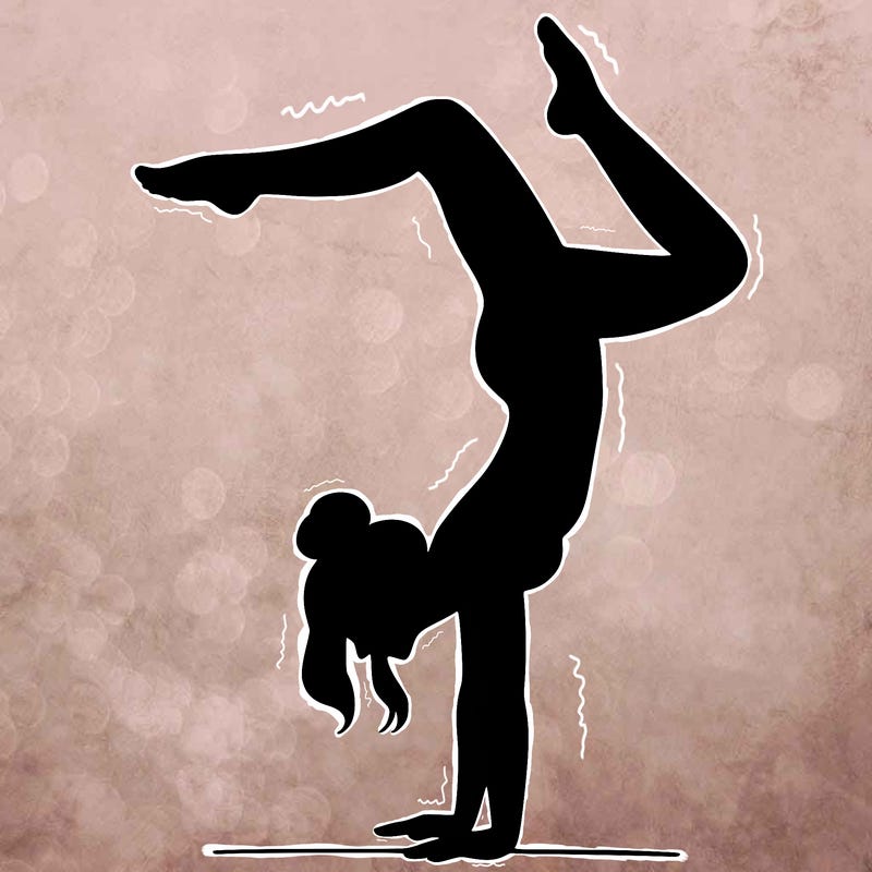 a woman doing a handstand