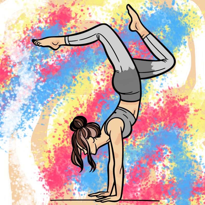 a woman doing a handstand