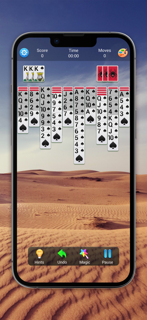 Solitaire Collection (Classic) - Jugabilidad de Spider Solitaire en un smartphone con un tema de fondo realista de paisaje desértico.