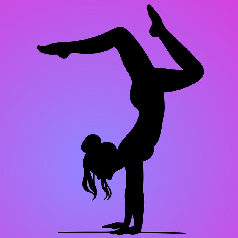 a woman doing a handstand