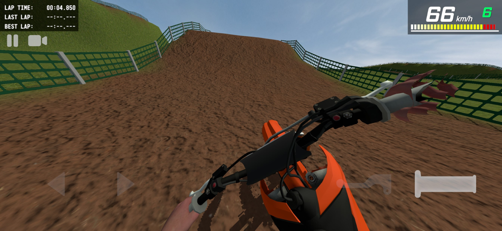 MX Engines - First person view of a dirt bike rider approaching a ramp on a motocross track