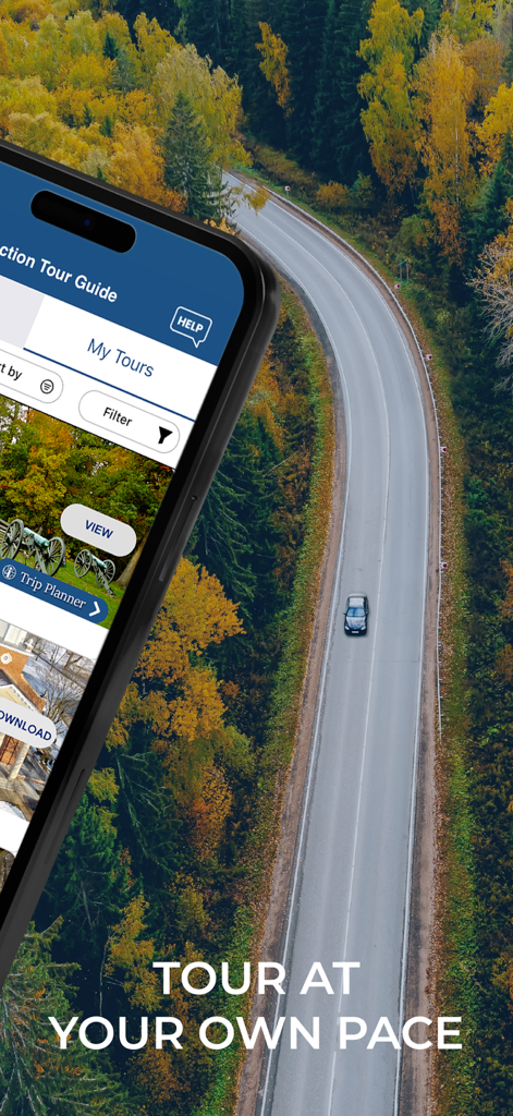 Action Tour Guide mobile app displayed over a scenic autumn road trip background