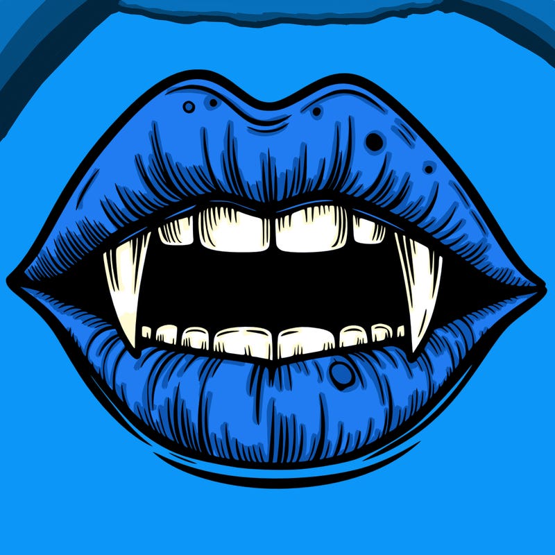 lips with vampire teeth