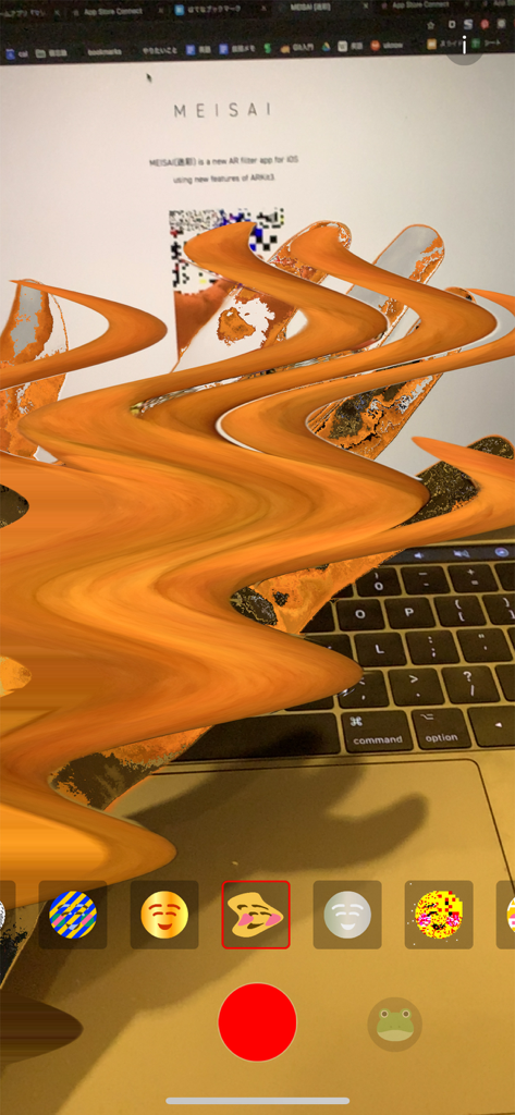 MEISAI - AR Filter - A person using the MEISAI app to apply a trippy wavy orange AR effect to their hand over a laptop keyboard