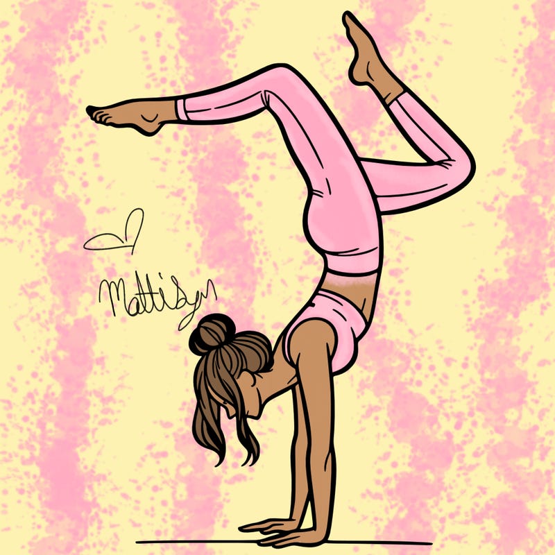 a woman doing a handstand