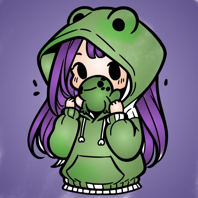 a girl holding a froggy hoodie