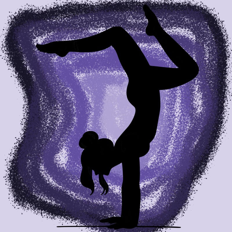 a woman doing a handstand