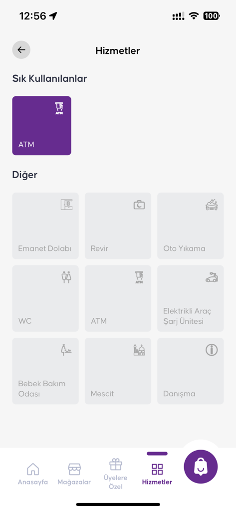 Shopla mobile app screen showing mall services including ATM, car wash, and electric vehicle charging
