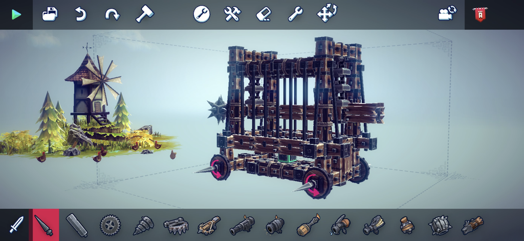 Besiege Mobile gameplay screenshot showing the construction of a complex wooden siege engine using the mobile building interface.