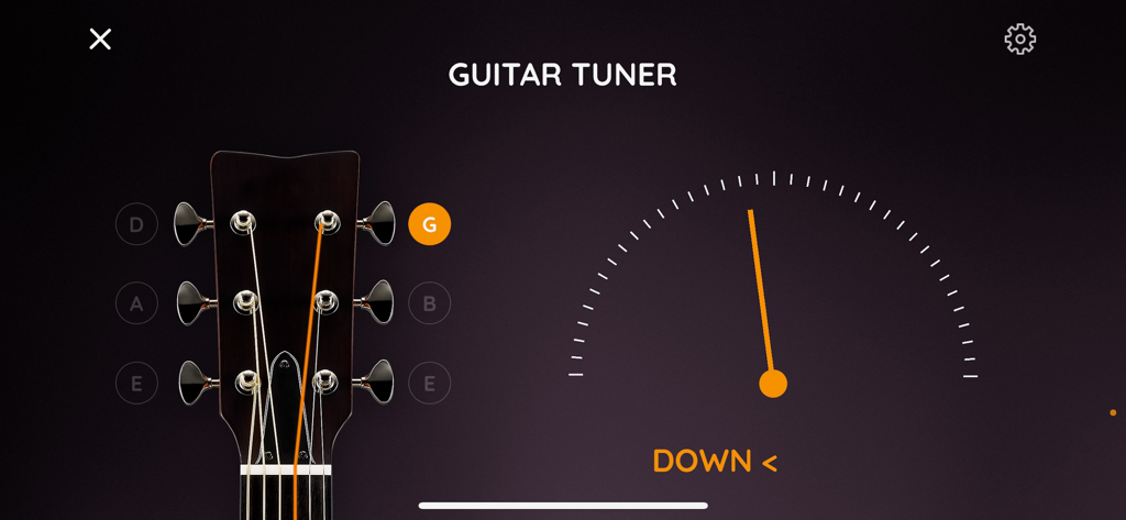 JamFactory - Multitrack Tunes - In-app guitar tuner interface with headstock visualization and needle-style tuning meter