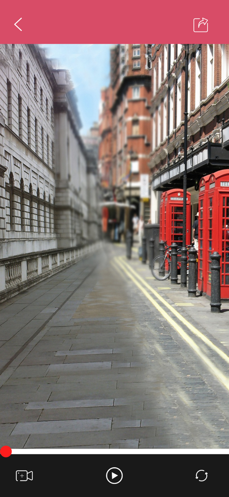 Video editing interface showing a street scene with red telephone booths being retouched