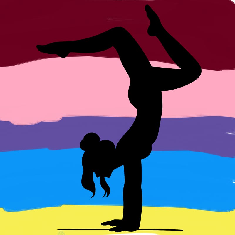 a woman doing a handstand