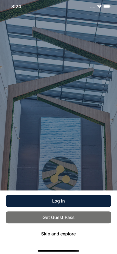 Anatomy fitness app welcome screen featuring a luxury gym interior and login buttons