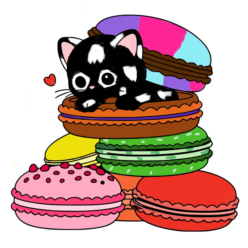 a kitten popping out of a stack of pastel macarons
