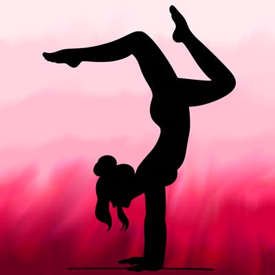 a woman doing a handstand