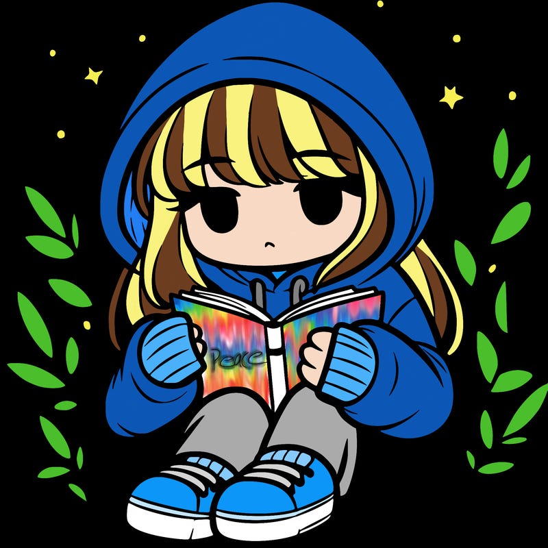 girl in oversized hoodie reading a book