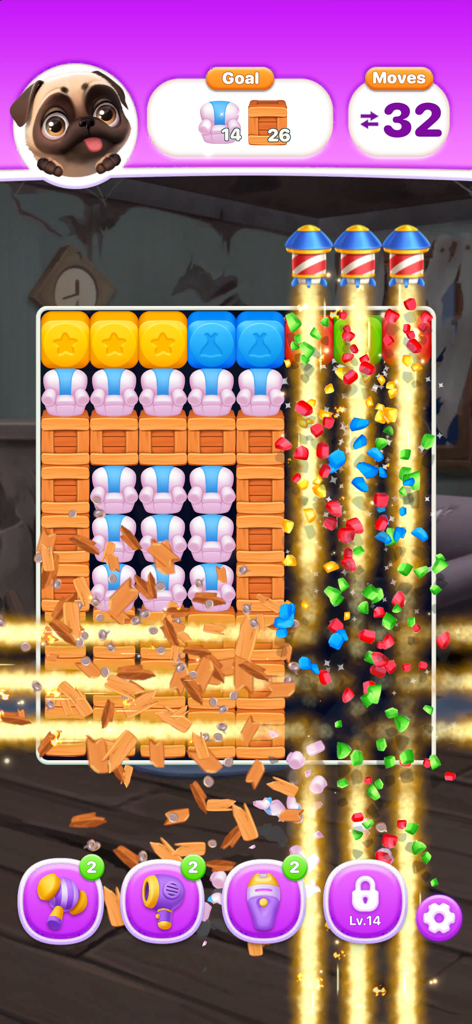 Gameplay screenshot showing rocket boosters clearing wooden crates and armchairs in a puzzle level