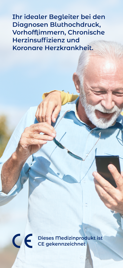 An older man looking at the iATROS heart patient app on his smartphone