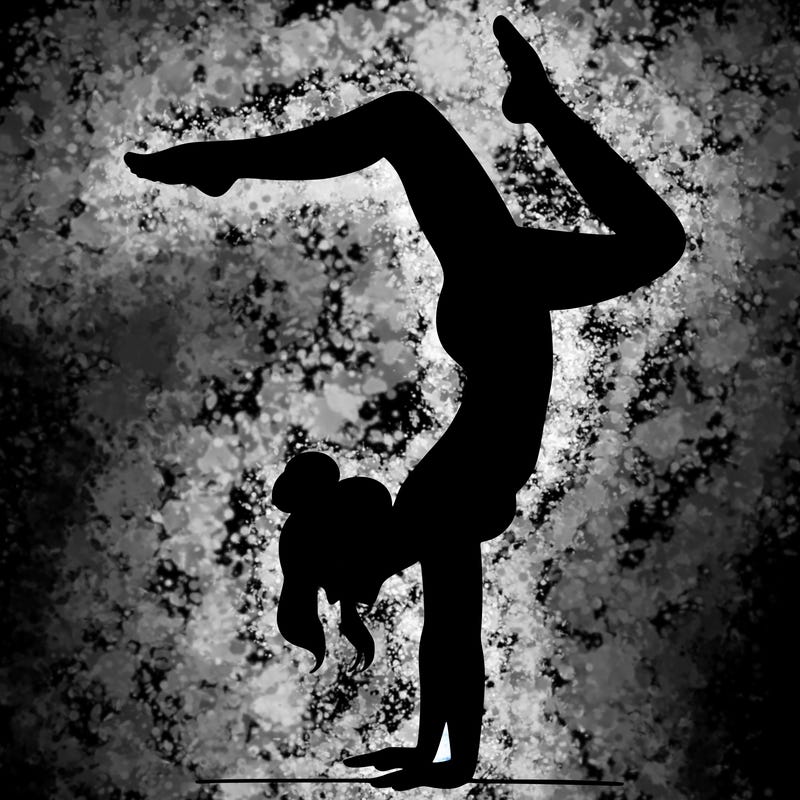 a woman doing a handstand