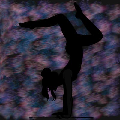 a woman doing a handstand
