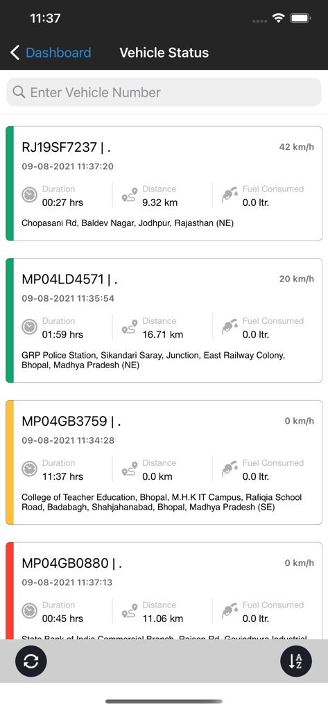 Mobile dashboard screen showing real-time vehicle status tracking with speed distance and location details for multiple fleet vehicles