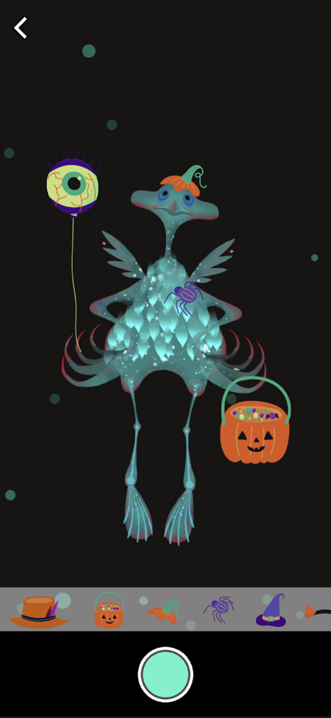 Un monstruo azul decorado con un sombrero de calabaza y un globo de ojo en un juguete digital con temática de Halloween
