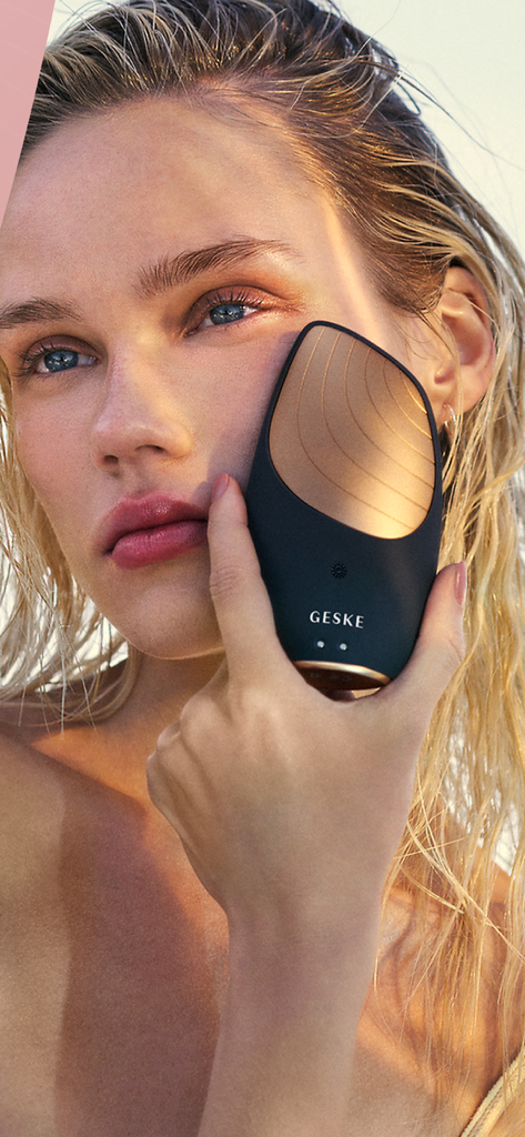 GESKE: German Beauty Tech - A woman applying a GESKE German beauty tech device to her cheek