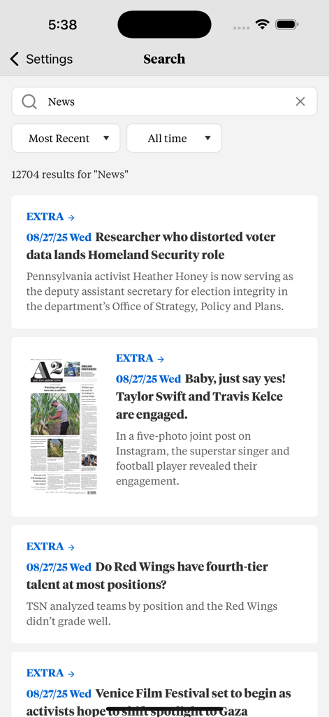 Search results screen in The Ann Arbor News app showing headlines about local politics sports and entertainment