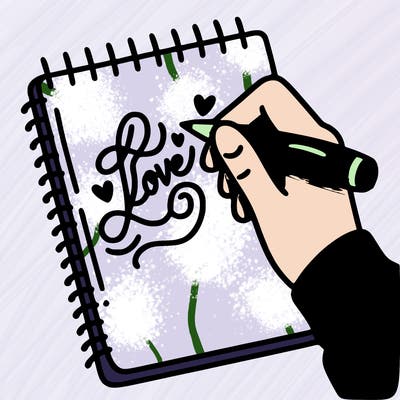 a hand writing “love” in calligraphy on a notebook