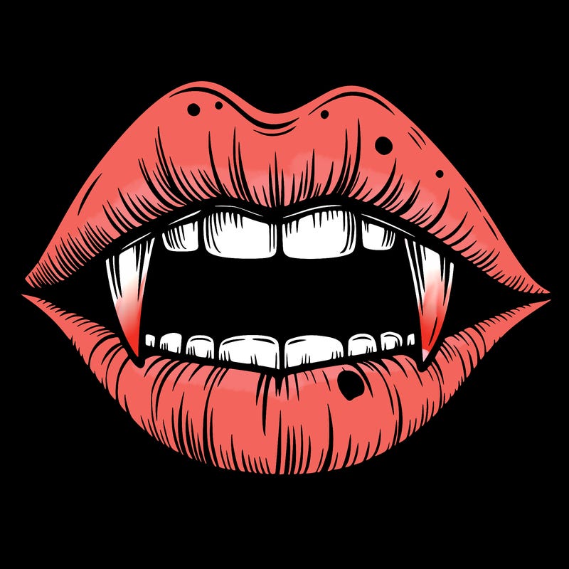 lips with vampire teeth