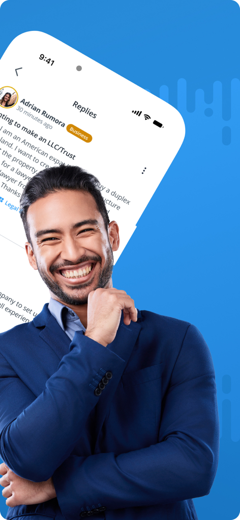 A smiling male professional in a blue suit with the BiggerPockets app forum in the background.