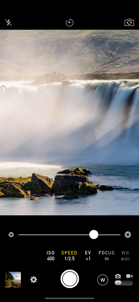 Manual Camera 4 - Manual Camera 4 interface showing manual shutter speed settings for a long exposure waterfall photo.