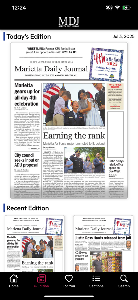 Marietta Daily Journal - The e-Edition screen of the Marietta Daily Journal app showing a digital replica of the local newspaper