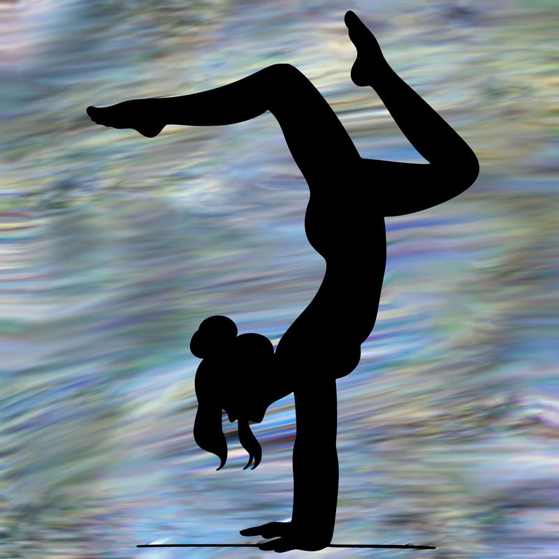 a woman doing a handstand