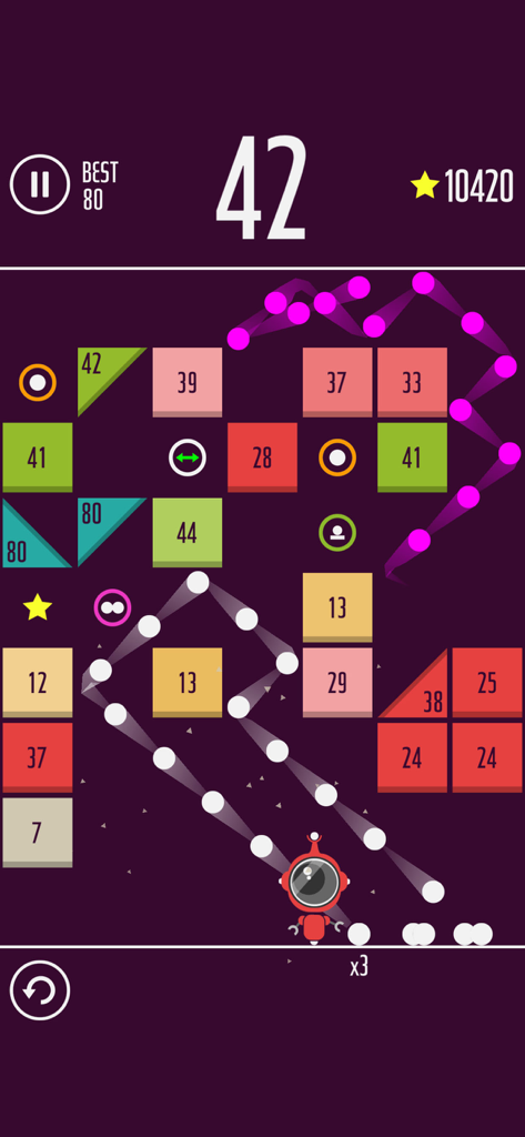 One More Brick - A screenshot of One More Brick gameplay showing dozens of white balls bouncing and breaking numbered colorful blocks.