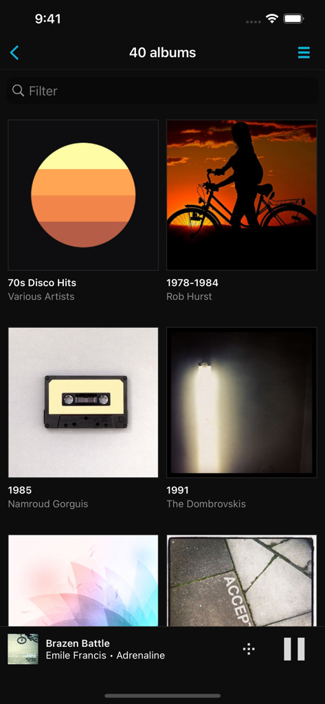 MusicLife - MusicLife app displaying a library of albums in a grid format with a now playing bar at the bottom.