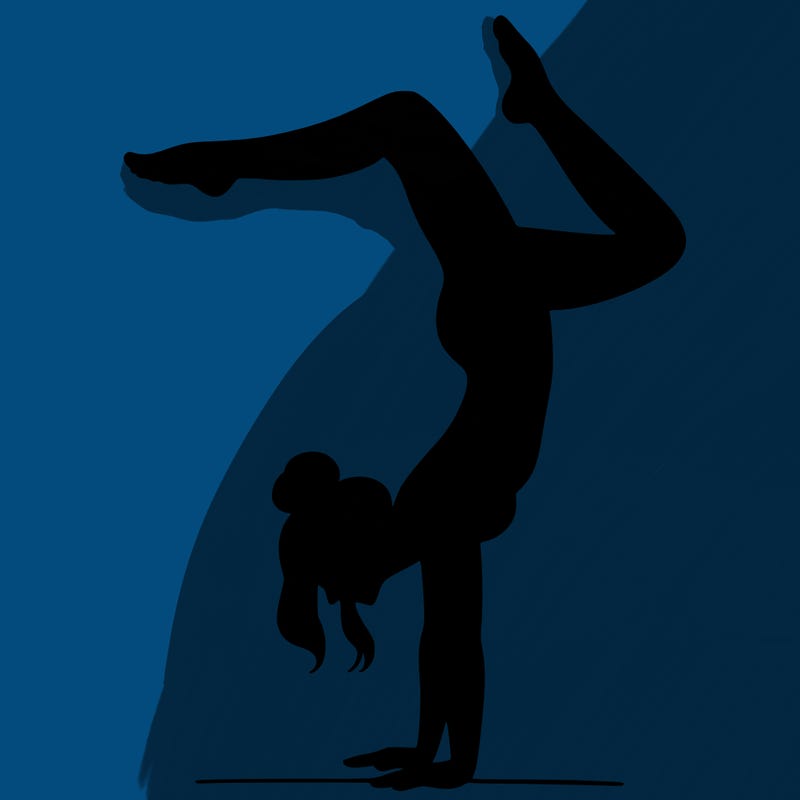 a woman doing a handstand