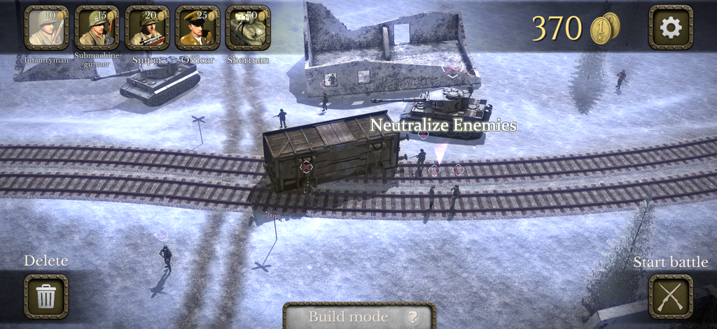 Battlefront Europe: WW2 Heroes - Vista de arriba hacia abajo de un campo de batalla nevado de la Segunda Guerra Mundial en modo de construcción con tanques y unidades de infantería cerca de una vía férrea