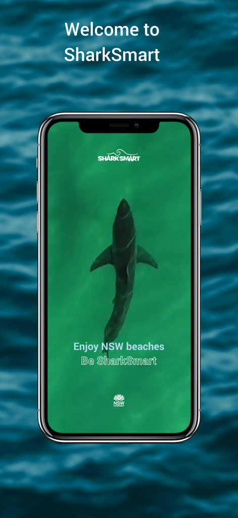 SharkSmart - SharkSmart app welcome screen showing a shark swimming in green water with the text Welcome to SharkSmart and Enjoy NSW beaches
