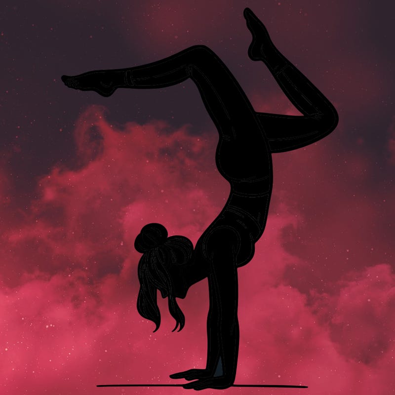 a woman doing a handstand